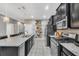 Modern kitchen with stainless steel appliances and granite countertops at 4738 Terrasonesta Dr, Davenport, FL 33837