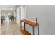 Bright and airy entryway with tile flooring and a console table at 4738 Terrasonesta Dr, Davenport, FL 33837