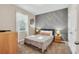 Comfortable bedroom with a double bed, and wood dresser at 4738 Terrasonesta Dr, Davenport, FL 33837