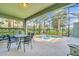 Screened-in patio with pool and seating area at 4738 Terrasonesta Dr, Davenport, FL 33837
