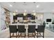 Modern kitchen with granite countertops and a breakfast bar at 4738 Terrasonesta Dr, Davenport, FL 33837