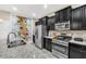 Modern kitchen with stainless steel appliances at 4738 Terrasonesta Dr, Davenport, FL 33837