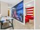 Game room with air hockey table and themed murals at 4738 Terrasonesta Dr, Davenport, FL 33837