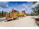 playground with sand and play structures at 4738 Terrasonesta Dr, Davenport, FL 33837