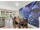 Bright dining area with table and chairs, featuring a large underwater mural at 4738 Terrasonesta Dr, Davenport, FL 33837