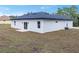 Single-story home with a dark gray roof and white exterior at 161 Marion Oaks Trail, Ocala, FL 34473