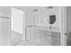 Double vanity bathroom with gray tile flooring at 161 Marion Oaks Trail, Ocala, FL 34473