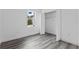 Bright bedroom with wood-look flooring and closet at 161 Marion Oaks Trail, Ocala, FL 34473