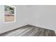Simple bedroom with a window and wood-look floors at 161 Marion Oaks Trail, Ocala, FL 34473