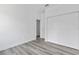 Bedroom with double door closet and wood-look floors at 161 Marion Oaks Trail, Ocala, FL 34473