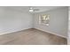 Spacious bedroom featuring wood-look floors and a large window at 2140 Ridge Dr, Winter Park, FL 32792