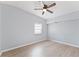 Light and airy bedroom with ceiling fan and wood floors at 2140 Ridge Dr, Winter Park, FL 32792