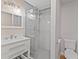 Modern bathroom with a large walk-in shower and white vanity at 2140 Ridge Dr, Winter Park, FL 32792