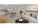 Open floor plan living area features modern furniture and stainless steel appliances at 2140 Ridge Dr, Winter Park, FL 32792