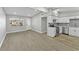 Modern kitchen with white cabinets, stainless steel appliances and wood-look flooring at 2140 Ridge Dr, Winter Park, FL 32792