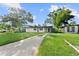 Single story home with a large front yard and driveway at 2140 Ridge Dr, Winter Park, FL 32792