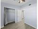 Bedroom with wood-look floors, a closet, and ceiling fan at 2140 Ridge Dr, Winter Park, FL 32792