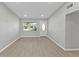 Bright living room with neutral walls and wood-look flooring at 2140 Ridge Dr, Winter Park, FL 32792