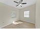 Bright bedroom with ceiling fan and wood-look floors at 2140 Ridge Dr, Winter Park, FL 32792