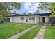 Updated home exterior boasts a modern design and spacious driveway at 2140 Ridge Dr, Winter Park, FL 32792