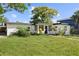 Mid-century modern home with a well-maintained lawn at 2140 Ridge Dr, Winter Park, FL 32792