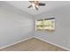 Simple bedroom with wood-look floors and a large window at 2140 Ridge Dr, Winter Park, FL 32792