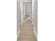 Bright hallway with wood-look floors and access to multiple rooms at 2140 Ridge Dr, Winter Park, FL 32792