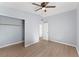 Spacious bedroom with ceiling fan and wood-look floors at 2140 Ridge Dr, Winter Park, FL 32792