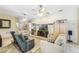 Bright living room featuring a large TV and comfy furniture at 1381 Hazeldene Mnr, Deland, FL 32724