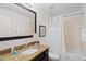 Bathroom with granite vanity, shower/tub combo, and modern fixtures at 8091 Brooksville Dr, Davenport, FL 33896