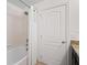Clean bathroom with a tub and shower, and granite countertop at 8091 Brooksville Dr, Davenport, FL 33896