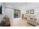Living room with patio access and comfortable seating at 8091 Brooksville Dr, Davenport, FL 33896