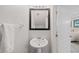Clean bathroom with pedestal sink and mirror at 8091 Brooksville Dr, Davenport, FL 33896