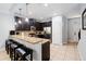 Eat-in kitchen with granite countertops and breakfast bar at 8091 Brooksville Dr, Davenport, FL 33896