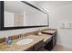 Double vanity bathroom with granite countertops and modern fixtures at 8091 Brooksville Dr, Davenport, FL 33896