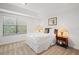 Comfortable bedroom with a queen-size bed and plenty of natural light at 8091 Brooksville Dr, Davenport, FL 33896