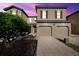 Two-story townhome with two-car garage and landscaping at 8091 Brooksville Dr, Davenport, FL 33896
