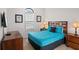 Second bedroom with a queen bed, nightstands, and wall-mounted TV at 8091 Brooksville Dr, Davenport, FL 33896