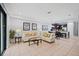 Bright and airy living room featuring a comfortable sofa and access to a patio at 8091 Brooksville Dr, Davenport, FL 33896