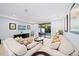 Spacious living area featuring comfortable sofas and a large TV at 8091 Brooksville Dr, Davenport, FL 33896