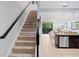 Carpeted staircase leading to the upper level of the home at 8091 Brooksville Dr, Davenport, FL 33896