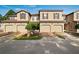 Tan townhome with double garage and curb appeal at 8091 Brooksville Dr, Davenport, FL 33896