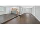 Open living area with dark brown wood-look vinyl flooring throughout at 313 Story Partin Rd, Orlando, FL 32833