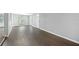 Spacious living room featuring dark brown vinyl flooring and gray walls at 313 Story Partin Rd, Orlando, FL 32833