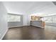 Open living area with a view of the kitchen and a door to the outside at 313 Story Partin Rd, Orlando, FL 32833