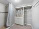 Updated bathroom with shower, vanity, and linen shelving at 313 Story Partin Rd, Orlando, FL 32833