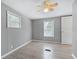 Charming bedroom with hardwood floors, ceiling fan, and window at 313 Story Partin Rd, Orlando, FL 32833