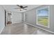 Spacious bedroom with hardwood floors, ceiling fan and large window at 313 Story Partin Rd, Orlando, FL 32833