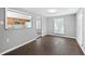 Bright dining area with dark vinyl flooring and view of kitchen at 313 Story Partin Rd, Orlando, FL 32833