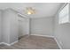 Bedroom with mirrored closet doors and ceiling fan at 313 Story Partin Rd, Orlando, FL 32833